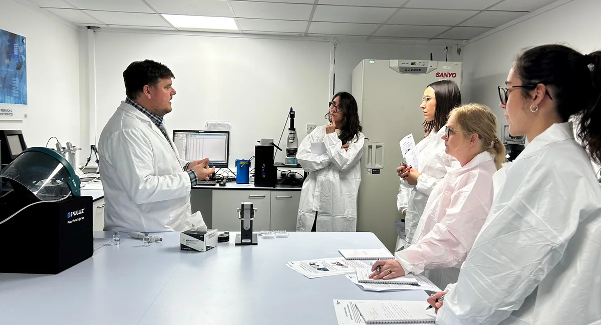 Participants learning freeze-drying techniques in a laboratory workshop